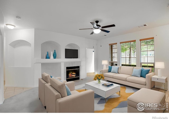 4672 W 20th Street Rd Unit 1311, Greeley, CO 80634 - living area featuring ceiling fan, a tile fireplace, and light tile patterned floors