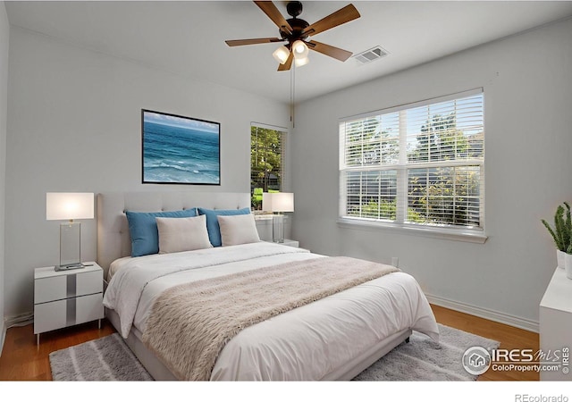 4672 W 20th Street Rd Unit 1311, Greeley, CO 80634 - bedroom featuring wood finished floors and baseboards