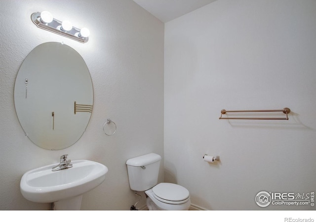 4672 W 20th Street Rd Unit 1311, Greeley, CO 80634 - half bathroom with a sink and toilet