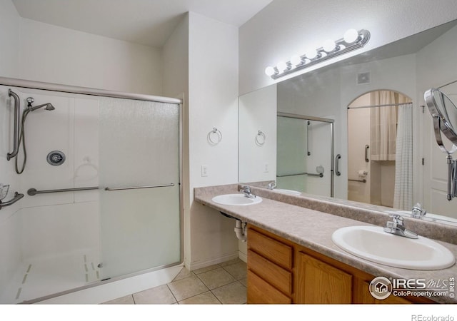 4672 W 20th Street Rd Unit 1311, Greeley, CO 80634 - bathroom featuring a shower stall and tile patterned floors