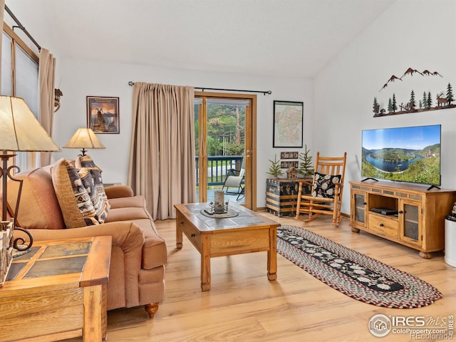1316 Kinnikinnic Ct, Estes Park, CO 80517 - living room featuring wood finished floors and lofted ceiling