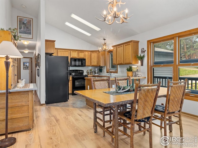 1316 Kinnikinnic Ct, Estes Park, CO 80517 - dining room featuring a chandelier, light wood-type flooring, healthy amount of natural light, and high vaulted ceiling