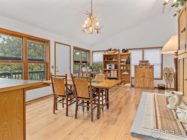 1316 Kinnikinnic Ct, Estes Park, CO 80517 - dining space featuring a chandelier, light wood-style floors, and lofted ceiling