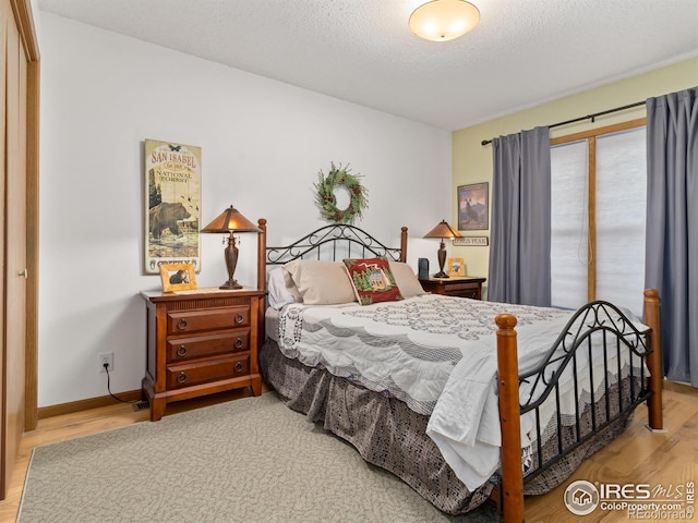 1316 Kinnikinnic Ct, Estes Park, CO 80517 - bedroom featuring wood finished floors