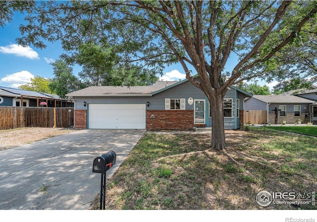 1634 San Juan Cir, Evans, CO 80620 - ranch-style home featuring brick siding, a garage, and concrete driveway