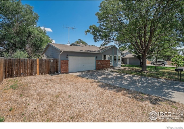 1634 San Juan Cir, Evans, CO 80620 - single story home with brick siding, driveway, and an attached garage