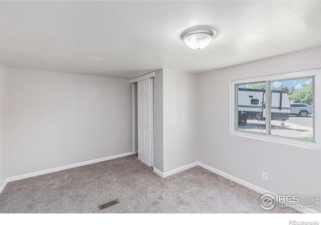 8416 Peakview Dr, Fort Collins, CO 80528 - empty room with a textured ceiling and carpet flooring
