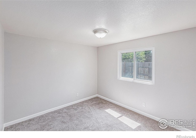 8416 Peakview Dr, Fort Collins, CO 80528 - unfurnished room featuring carpet flooring and a textured ceiling