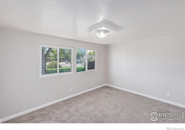 8416 Peakview Dr, Fort Collins, CO 80528 - empty room featuring carpet and a textured ceiling