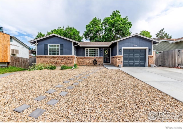 8696 W 86th Cir, Arvada, CO 80005 - ranch-style house with brick siding, a garage, and concrete driveway