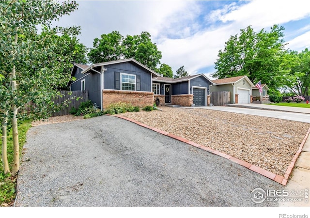 8696 W 86th Cir, Arvada, CO 80005 - single story home with brick siding, concrete driveway, and an attached garage