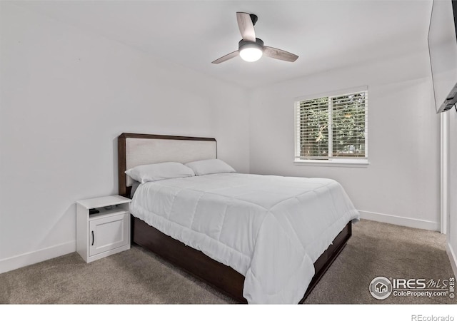 8696 W 86th Cir, Arvada, CO 80005 - carpeted bedroom featuring baseboards and ceiling fan