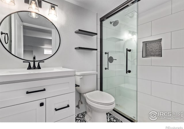 8696 W 86th Cir, Arvada, CO 80005 - full bathroom featuring a shower stall, vanity, and baseboard heating