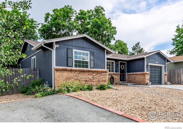 8696 W 86th Cir, Arvada, CO 80005 - single story home featuring brick siding, an attached garage, and concrete driveway