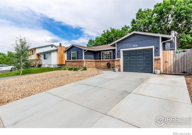 8696 W 86th Cir, Arvada, CO 80005 - ranch-style house with a garage, brick siding, and concrete driveway