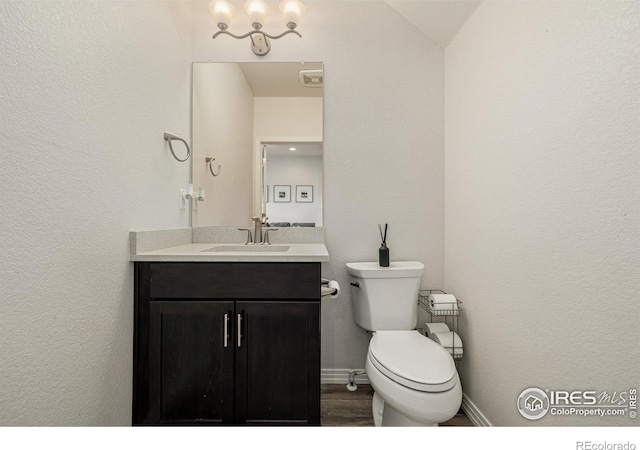 619 Brennan Cir, Erie, CO 80516 - bathroom featuring vanity and wood finished floors