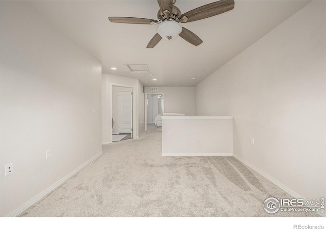 619 Brennan Cir, Erie, CO 80516 - spare room with a ceiling fan, light colored carpet, recessed lighting, and attic access