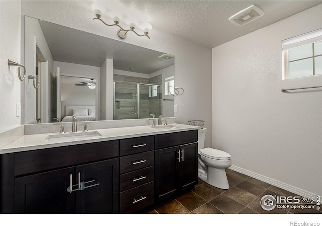 619 Brennan Cir, Erie, CO 80516 - bathroom featuring a shower stall, double vanity, tile patterned flooring, and a ceiling fan