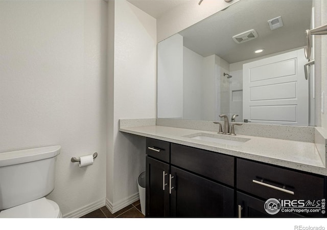 619 Brennan Cir, Erie, CO 80516 - full bath featuring vanity, tile patterned floors, and a shower
