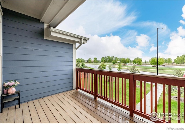 619 Brennan Cir, Erie, CO 80516 - wooden deck featuring a lawn