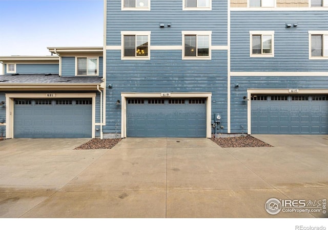 619 Brennan Cir, Erie, CO 80516 - view of front facade with a garage and concrete driveway