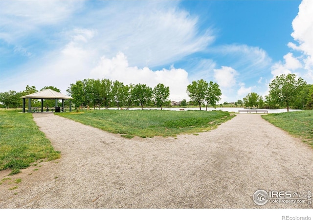 619 Brennan Cir, Erie, CO 80516 - surrounding community featuring a gazebo, a yard, driveway, and a detached carport