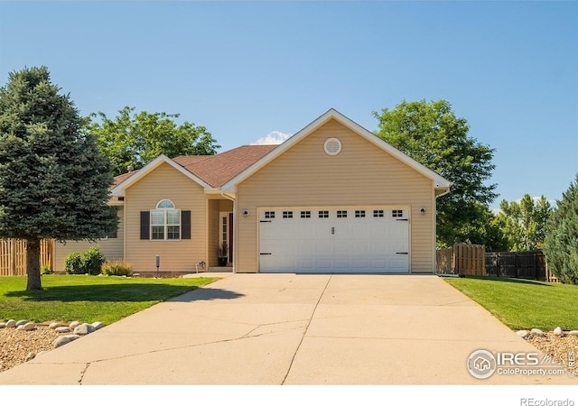 14053 Cottonwood Cir, Sterling, CO 80751 - ranch-style home with an attached garage and driveway