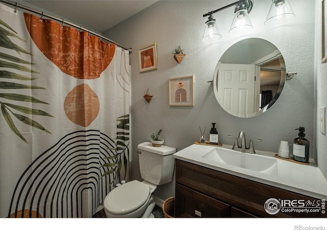 14053 Cottonwood Cir, Sterling, CO 80751 - bathroom with vanity, curtained shower, and a textured wall