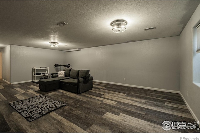 14053 Cottonwood Cir, Sterling, CO 80751 - living area with wood finished floors and a textured ceiling