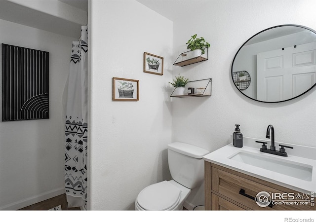 14053 Cottonwood Cir, Sterling, CO 80751 - bathroom featuring vanity and a shower with curtain
