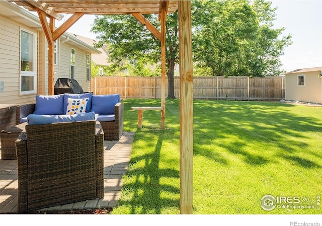14053 Cottonwood Cir, Sterling, CO 80751 - fenced backyard with outdoor lounge area and a pergola