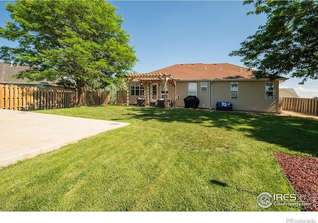 14053 Cottonwood Cir, Sterling, CO 80751 - rear view of house with a pergola, a patio area, and a fenced backyard