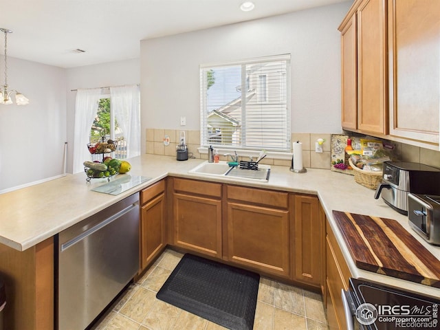 12912 Grant Cir E # A, Thornton, CO 80241 - kitchen featuring stainless steel dishwasher, a peninsula, light countertops, stove, and backsplash