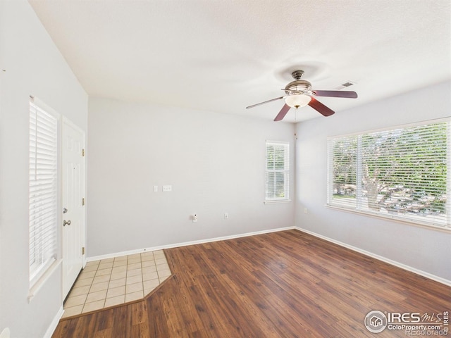 12912 Grant Cir E # A, Thornton, CO 80241 - unfurnished room featuring a ceiling fan and wood finished floors