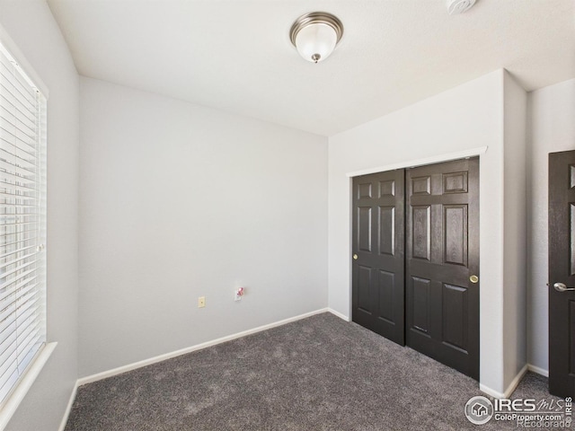 12912 Grant Cir E # A, Thornton, CO 80241 - unfurnished bedroom featuring carpet flooring and a closet