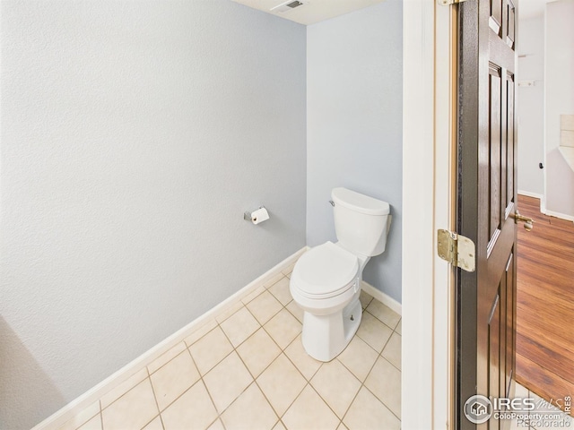 12912 Grant Cir E # A, Thornton, CO 80241 - bathroom featuring baseboards and tile patterned flooring