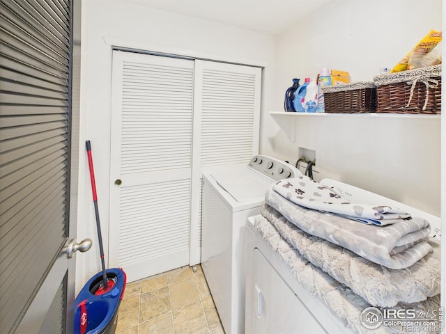 12912 Grant Cir E # A, Thornton, CO 80241 - washroom featuring washing machine and dryer and light stone finish flooring