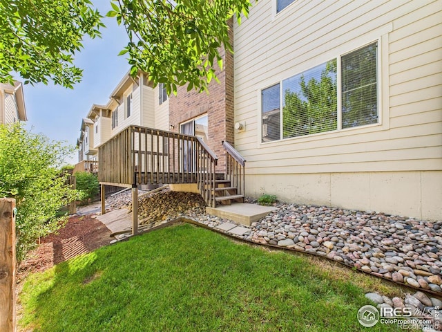 12912 Grant Cir E # A, Thornton, CO 80241 - view of yard with a wooden deck and stairway