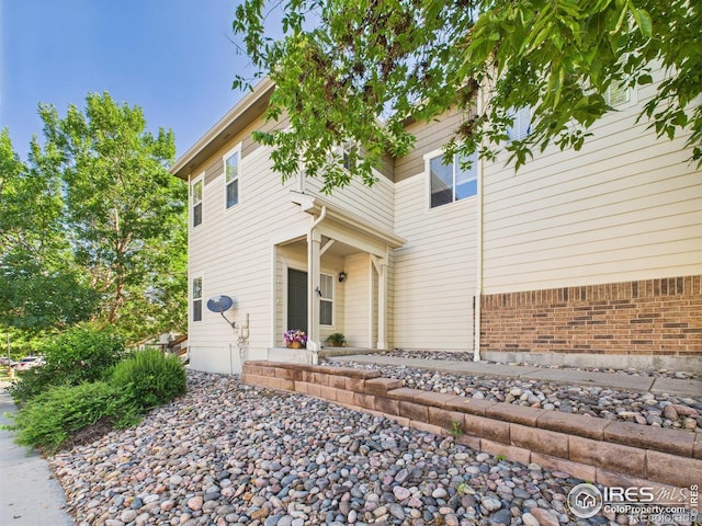 12912 Grant Cir E # A, Thornton, CO 80241 - view of front facade with brick siding
