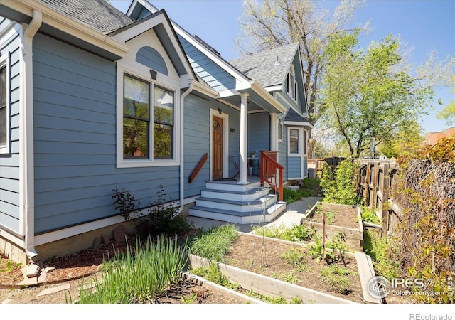 1605 17th St, Boulder, CO 80302 - view of front facade featuring a garden and roof with shingles