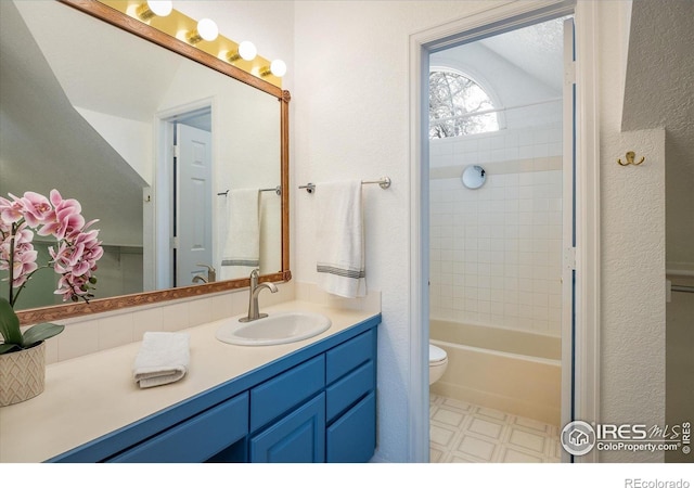 1605 17th St, Boulder, CO 80302 - bathroom featuring vanity, tile patterned floors, tub / shower combination, and a textured wall