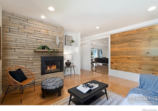 600 Monte Vista Ave, Fort Collins, CO 80521 - living area featuring a stone fireplace, recessed lighting, and wood finished floors