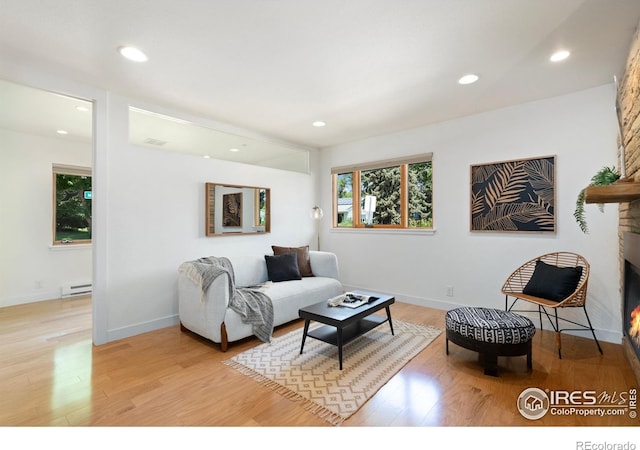 600 Monte Vista Ave, Fort Collins, CO 80521 - living area with a baseboard heating unit, light wood-type flooring, and recessed lighting