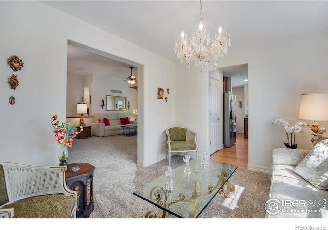 8305 E 149th Dr, Thornton, CO 80602 - carpeted living room featuring a ceiling fan and a chandelier