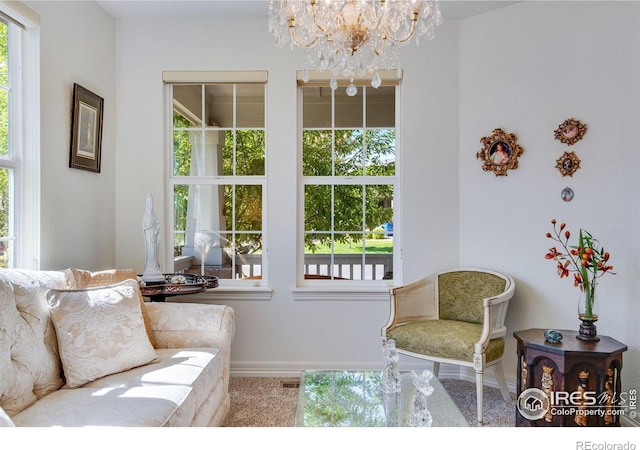 8305 E 149th Dr, Thornton, CO 80602 - carpeted living room featuring plenty of natural light and a chandelier
