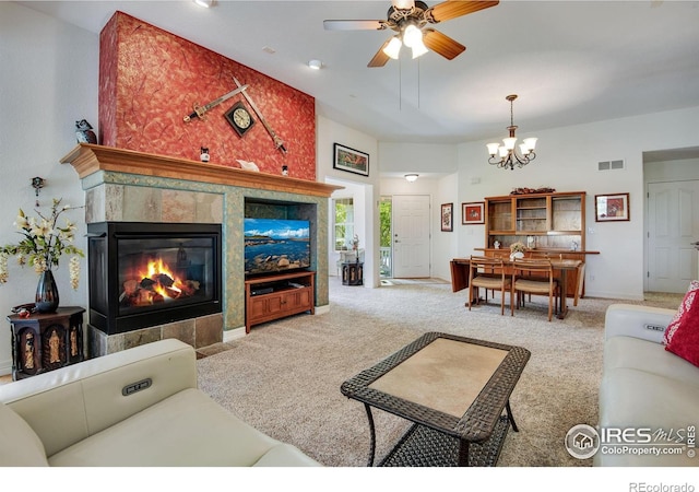 8305 E 149th Dr, Thornton, CO 80602 - carpeted living area with a chandelier, a ceiling fan, and a tile fireplace