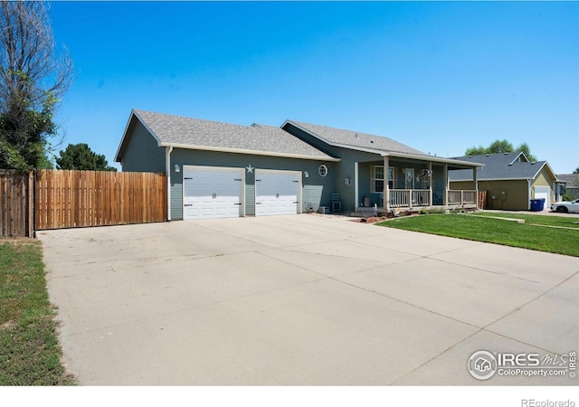 4521 Mesa Verde Dr, Greeley, CO 80634 - single story home with a porch, a garage, and driveway
