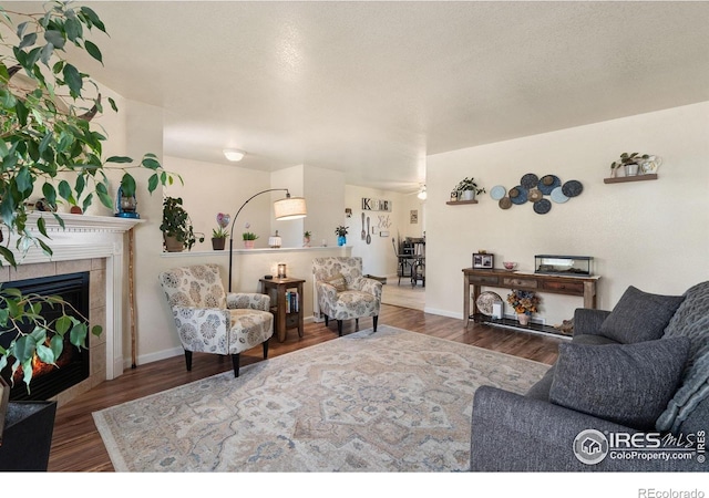 4521 Mesa Verde Dr, Greeley, CO 80634 - living room with wood finished floors and a tiled fireplace