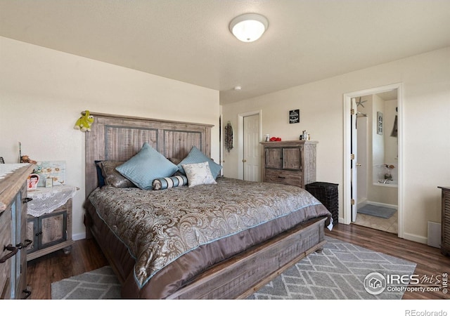 4521 Mesa Verde Dr, Greeley, CO 80634 - bedroom featuring wood finished floors and ensuite bathroom