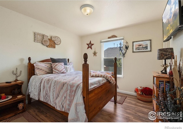 4521 Mesa Verde Dr, Greeley, CO 80634 - bedroom featuring wood finished floors and baseboards